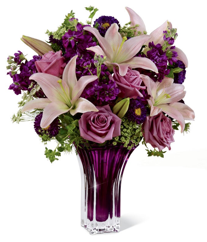 A Bouquet of  Lavender Roses, Pink LA Hybrid Lilies,  Purple Gilly Flowers, Queen Anne's Lace and Purple Matsumoto Asters in a Glass Vase