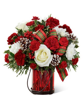 Christmas flowers delivery at send flowers with glass red vase of christmas roses and red berry holly