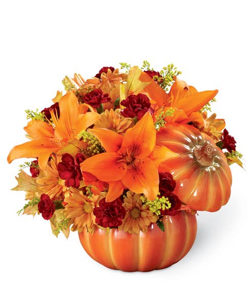 Pumpkin bouquet, orange asiatic lilies and cheap flowers inside a pumpkin