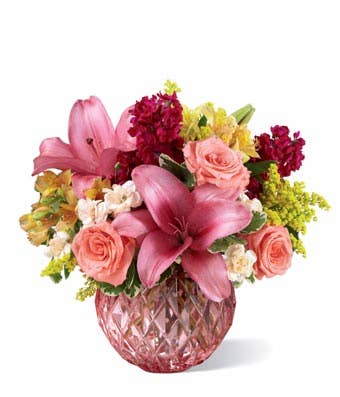 Miniature pink carnations, pink stock and pink roses bouquet with pink vase