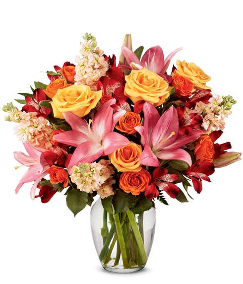 Premium peach rose and lily bouquet with orange roses and preach gilly flowers 