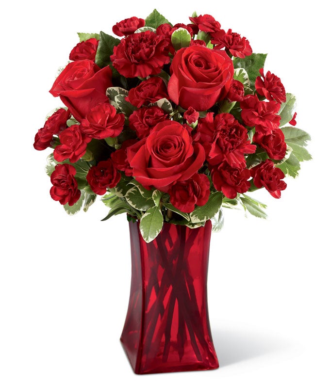 A Bouquet of  Long-Stem Red Roses and Seeded Eucalyptus in a Classic Glass Vase