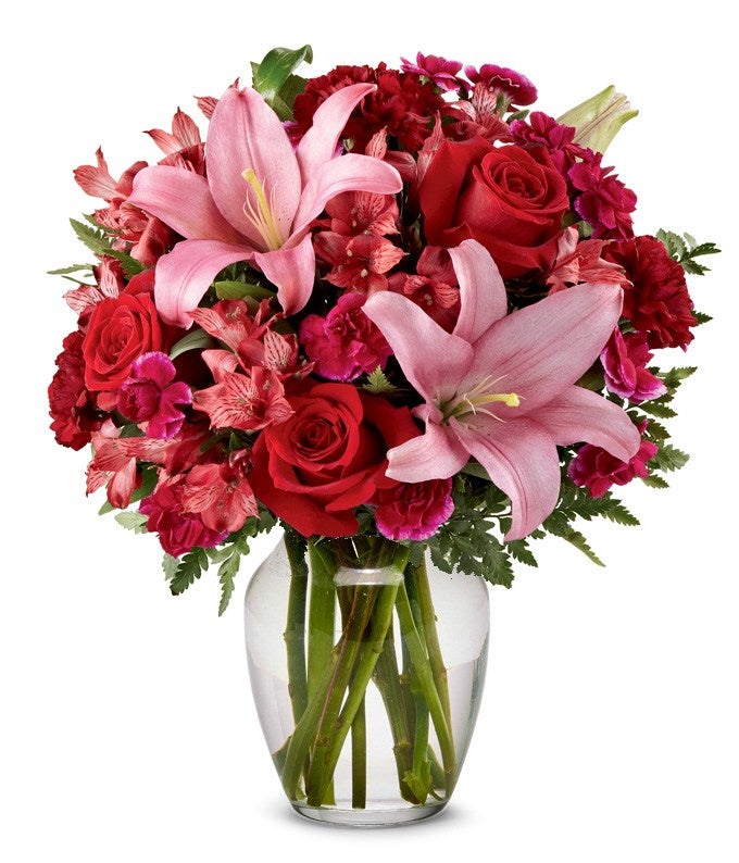 pink and red flower bouquet in a clear vase