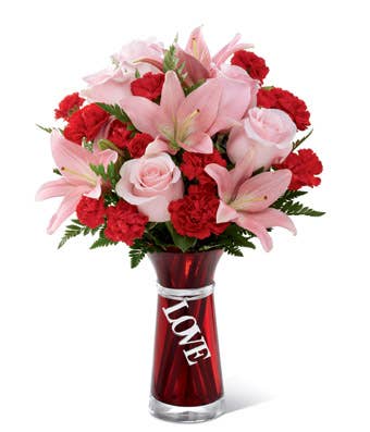 Blush pink lilies and red carnations