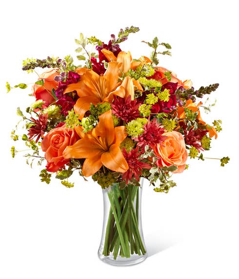 Orange lily bouquet with orange roses, brown chrysanthemums and snapdragons