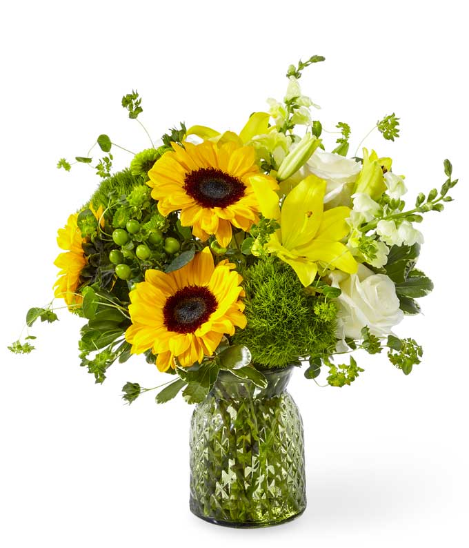A Bouquet of White Roses, Yellow Lilies, Sunflowers, Canary Snapdragons, Green Button Pom and Green Hypericum in a Keepsake Textured Vase
