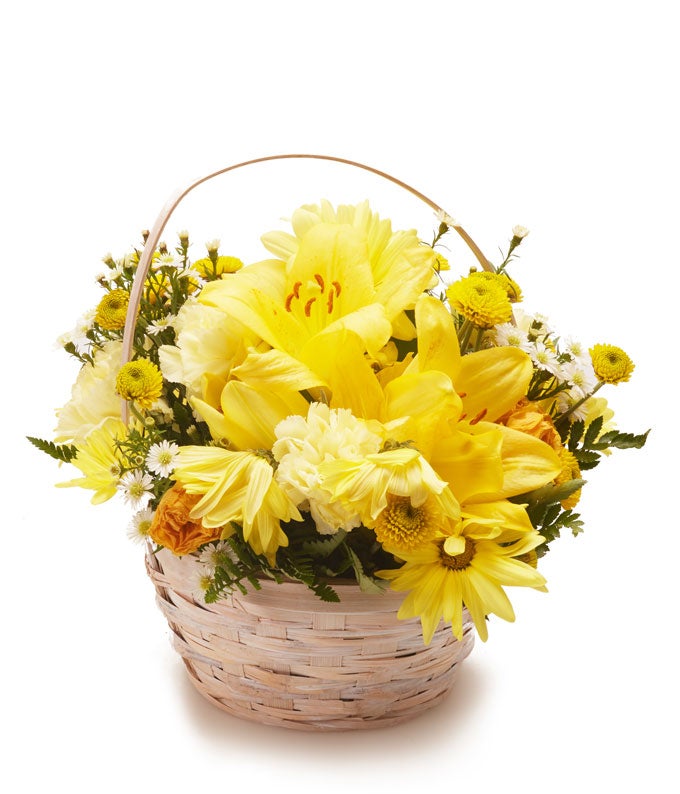 A Bouquet of Yellow Lilies, Yellow Spray Roses, Yellow Daisies, Cream Carnations and Baby's Breath in a Decorative Basket