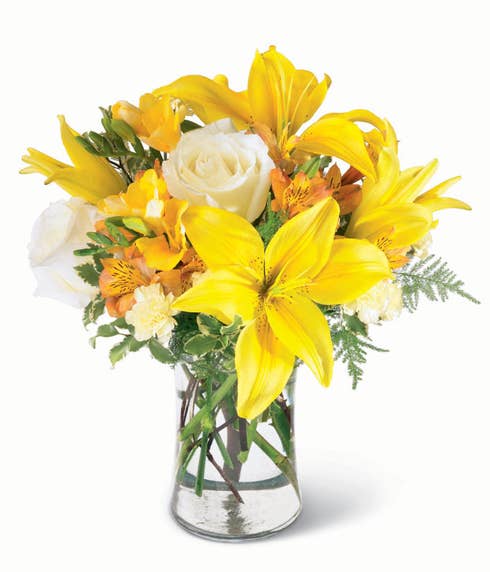 Yellow lilies, white roses and yellow carnations