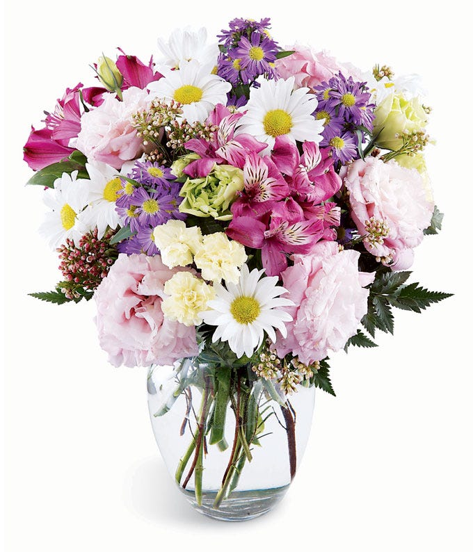 White daisies, pink alstroemeria and purple lisianthks in a mixed bouquet