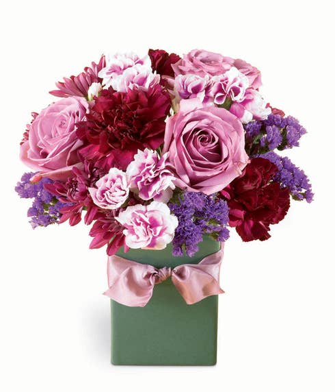 Lavender rose, burgundy carnations, and lavender miniature carnations bouquet