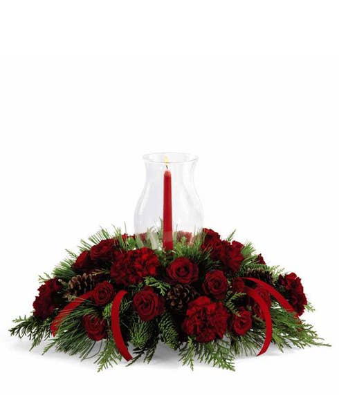 red rose floral centerpiece with red carnations and spray roses