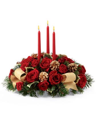 Red rose centerpiece with tapered candles with pine