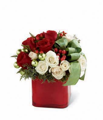 floral arrangement with red and white roses and decorations