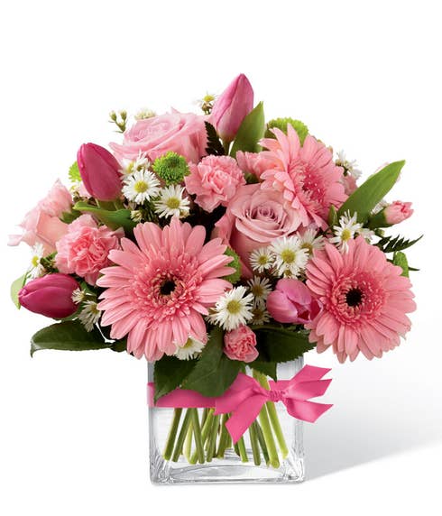 Flower arrangement with pink roses and pink tulips