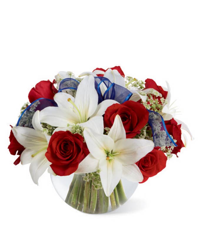 A Bouquet of Red Roses, White Asiatic Lilies, and  Queen Anne's Lace in a Glass Bubble Bowl with Sheer Blue Ribbon