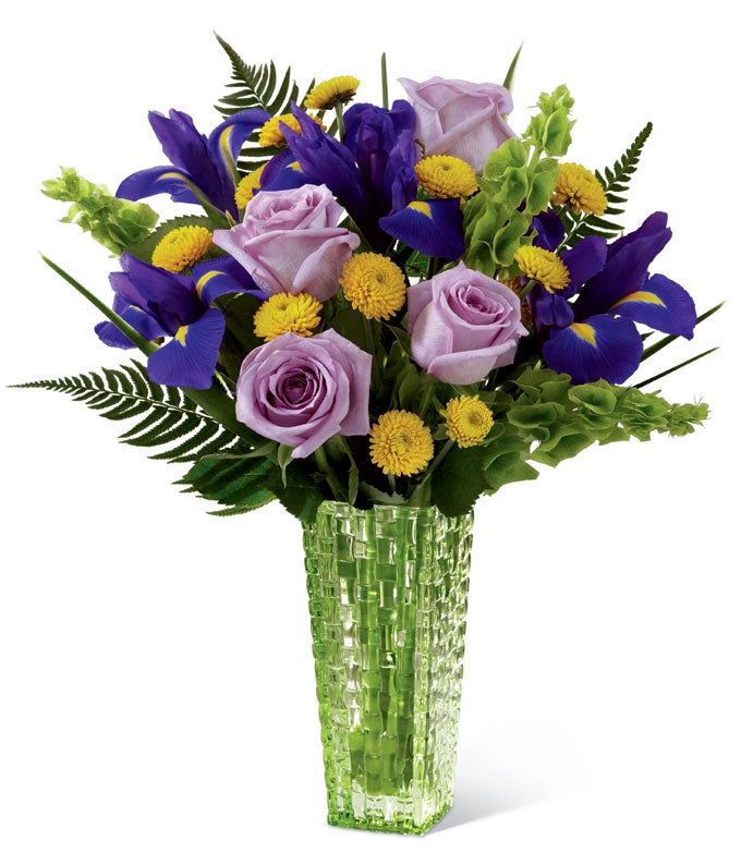 A Bouquet of Light-Purple Roses, Irises, Canary Button Poms and Bells of Ireland in a Designer Vase