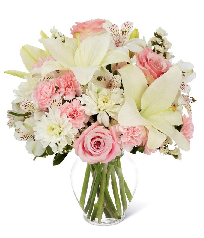 funeral flower bouquet with white lilies and pink roses