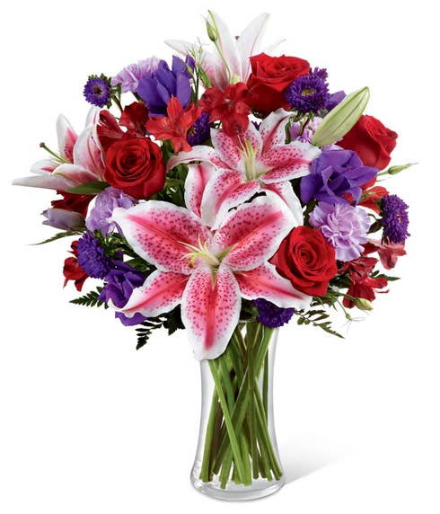 Stargazer lily with red roses, pink lilies and blue iris 