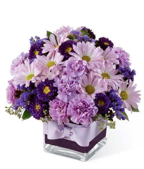 Lavender daisy bouquet of traditional daisies and purple carnations