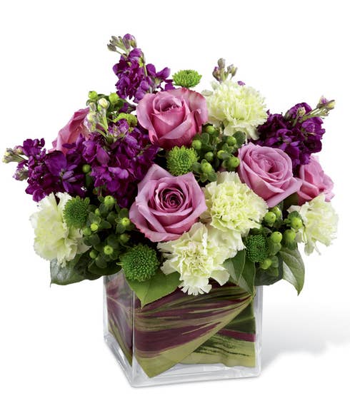 Purple rose bouquet of lavender roses, green carnations & hypericum berries