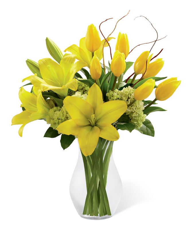 A Bouquet of Yellow Tulip Flowers, Yellow Asiatic Lilies, Green Mini Hydrangea and Lush Greens with Curly Willow Accents