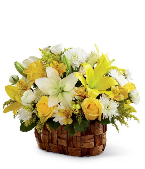 Flowers basket bouquet with yellow lilies, yellow roses and white LA hybrid lilies