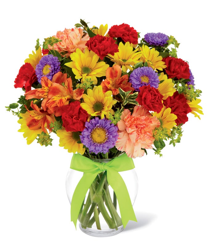 A Bouquet of  Yellow Daisies, Orange Peruvian Lilies, Lavender Matsumoto Asters, Orange Carnations, Red Mini Carnations, and Bupleurum in a Glass Vase with Decorative Ribbon