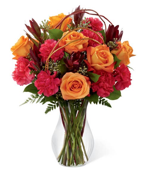 Orange roses and fuchsia carnations with curly willow branches 