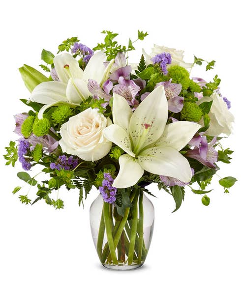 Lavender white lily arrangement with white roses 