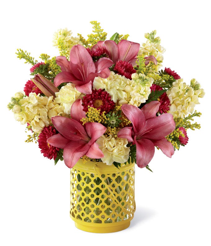 Pink lily bouquet with yellow carnations