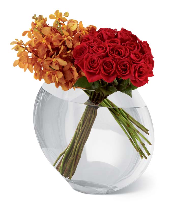 24-inch premium long-stemmed roses and golden Mokara orchids in a superior 13-inch clear glass pillow vase