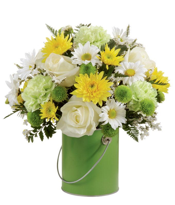 Green carnations, white roses, yellow cushion poms & daisies in green paint can