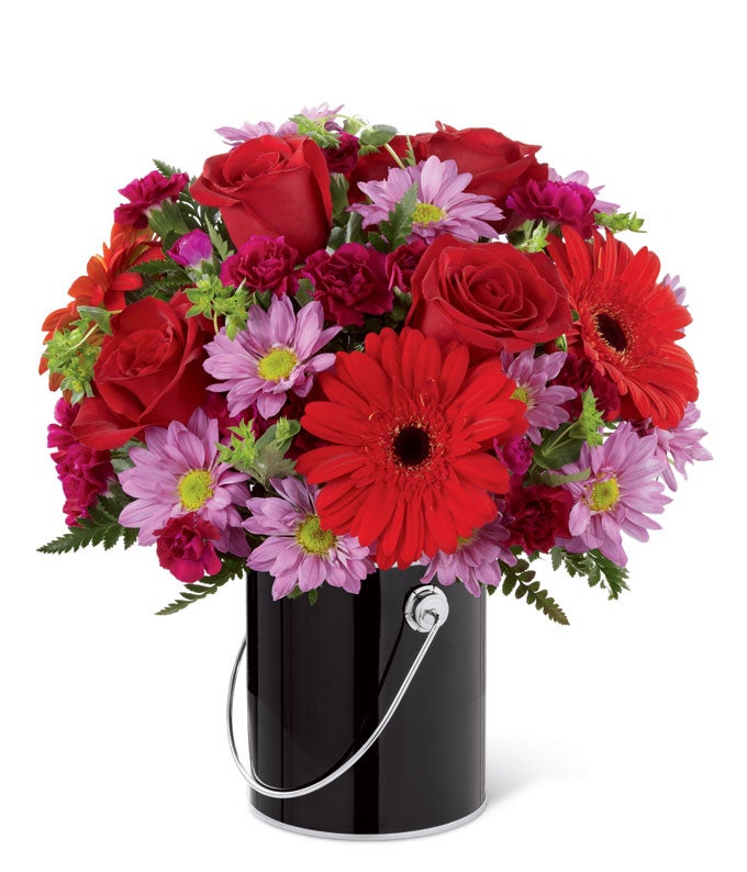 A Bouquet of  Red Roses, Red Gerbera Daisies, Plum Mini Carnations and  Lavender Traditional Daisies in a Black Paint Can Inspired Container