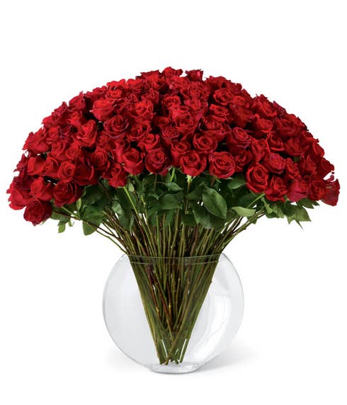 100 long stem red roses bouquet with a large round glass vase and card