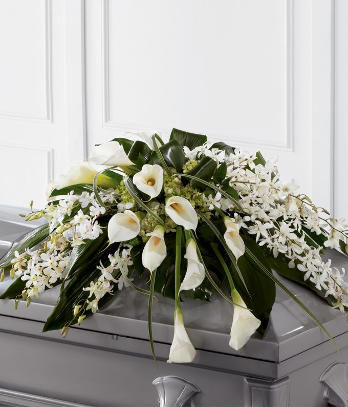 Casket Spray Including White Dendrobium Orchids, White Calla Lilies, Green Hydrangea, and Variety of Greens