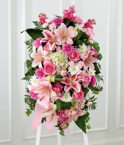 Oval pink rose, pink pompon and white hydrangea funeral standing spray