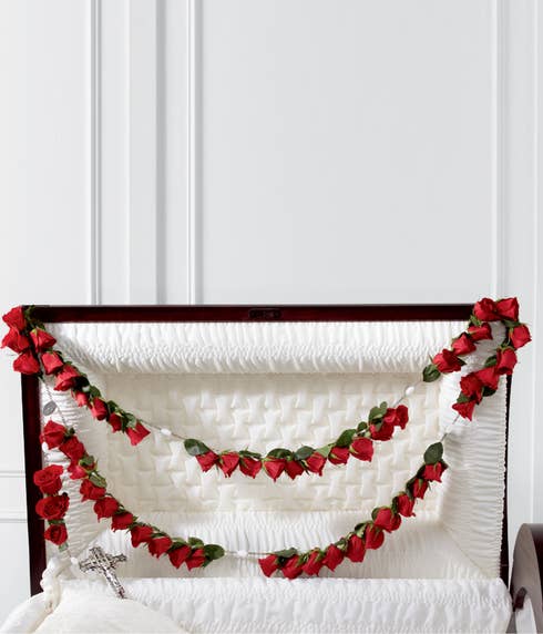 Red rose sympathy casket rosary arrangement