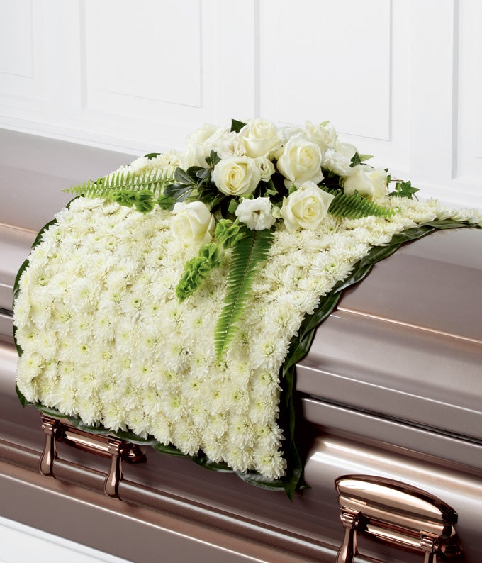 Casket Blanket Arrangement including White Chrysanthemums, White Roses, White Double Lisianthus and Bells of Ireland