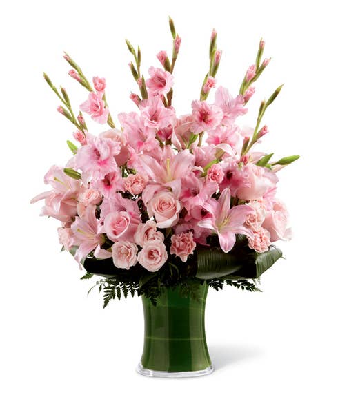 Sympathy flower bouquet with pink gladiolus, light pink roses and asiatic lilies