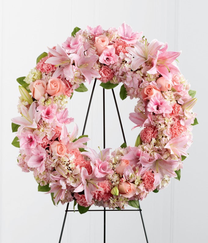 Round Flower arrangement including Pink Roses, Oriental Lilies, Hydrangea and Pink Carnations