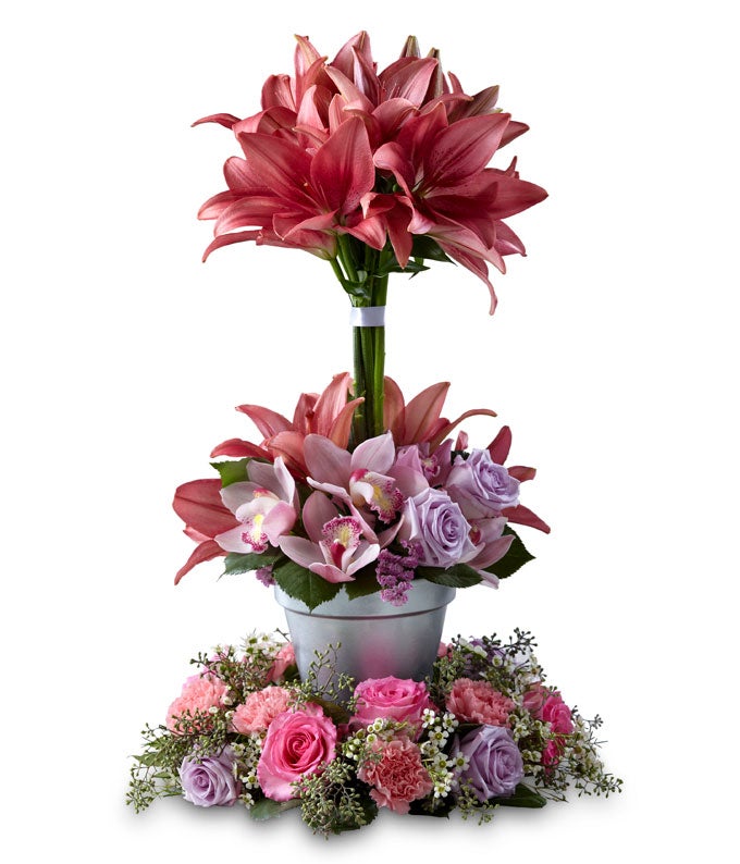 A Bouquet of Cymbidium Orchids, Hot Pink Roses, Lavender Roses, Pink Carnations, Statice, and  White Waxflower