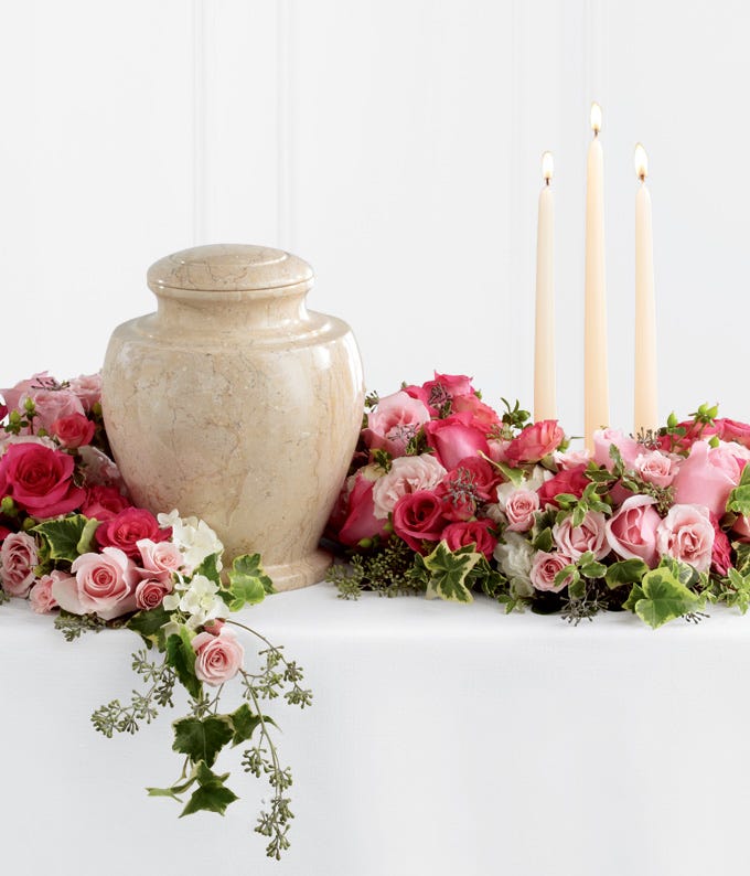 Remembrance arrangement with light pink roses and spray roses