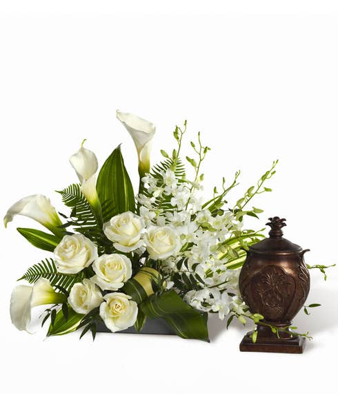 White rose and white calla lily urn flower arrangement for funeral or wake