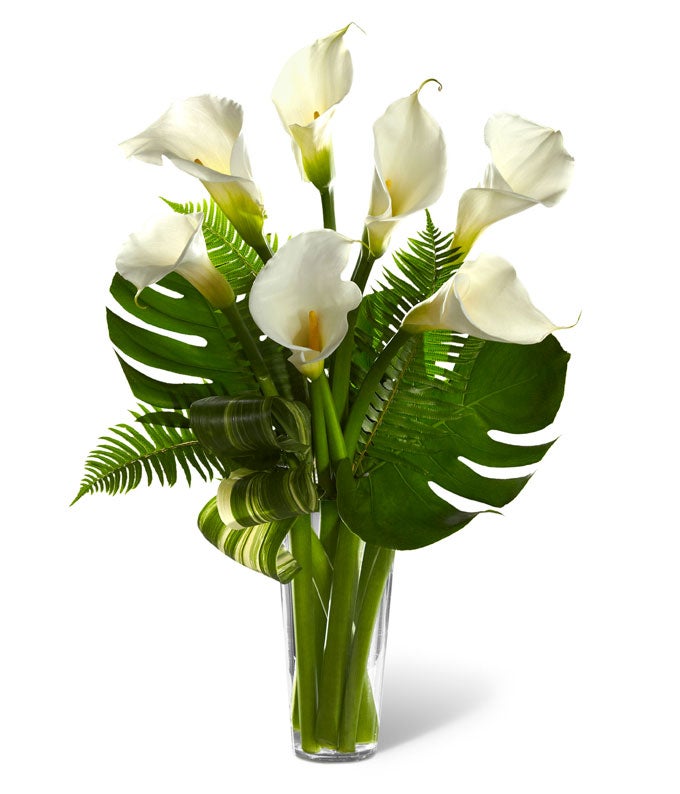 A Bouquet of White Calla Lilies, Sword Fern Fronds, and Lush Greens in a Clear French Vase