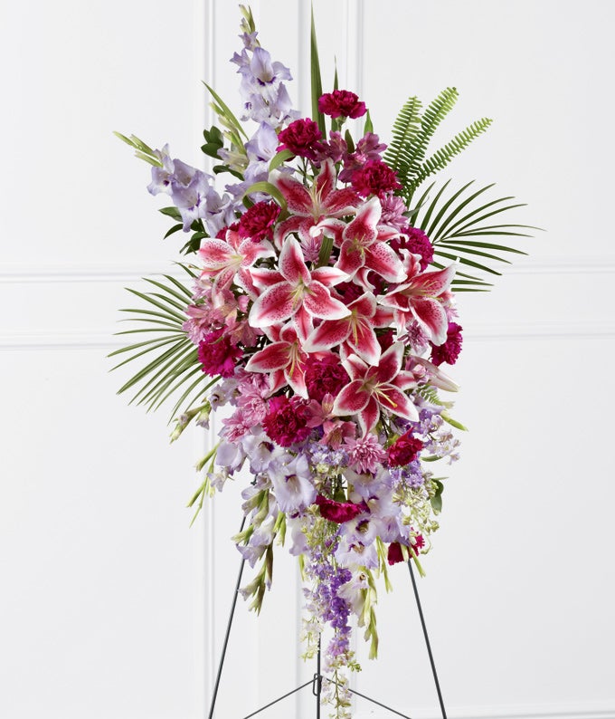 Flower Arrangement Including Lavender Gladiolus, Stargazer Lilies, Purple Larkspur, Hot Pink Carnations, Lavender Peruvian Lilies, and Light Violet Chrysanthemums with Condolence Card and Stand Included