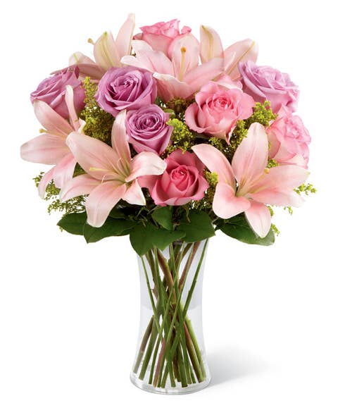 Pink asiatic lilies with purple roses and pink roses