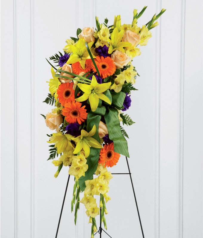 Flower Arrangement Including Yellow Gladiolus, Canary Asiatic Lilies, Crème de la Crème Roses, Orange Gerbera Daisies, and Purple Lisianthus with Card and  Stand Included