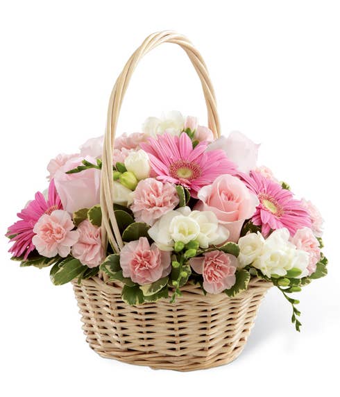 Sympathy basket with pink gerbera daisies and light pink roses in handled basket