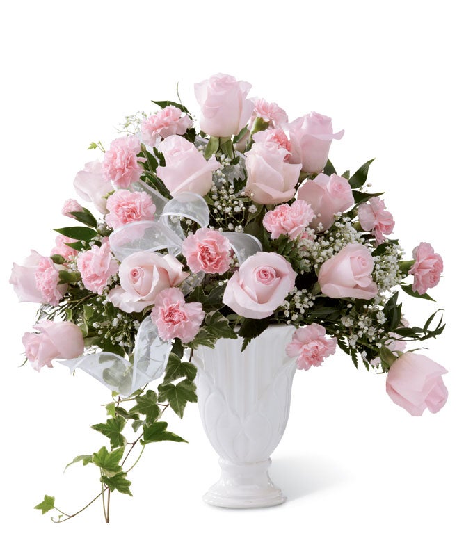 A Bouquet of Light Pink Roses, Pink Carnations, White Baby's Breath and Fresh Greens & Ivy in a Ceramic Pedestal Vase
