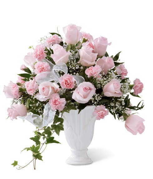 Sympathy pedestal vase with light pink roses and carnations with baby's breath